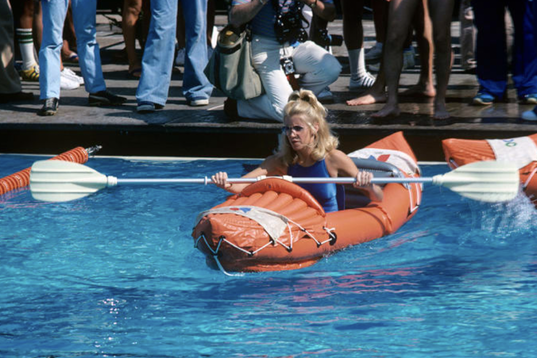 Suzanne Somers kayaks during an event, 1977. 